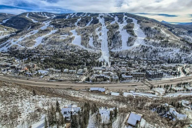 a view of lot of road and yard