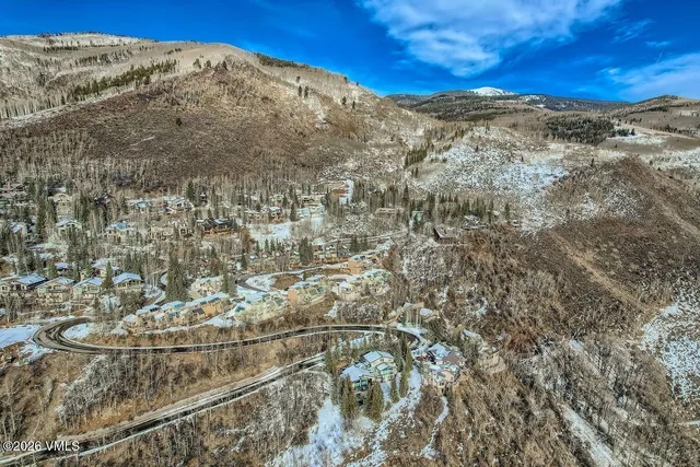 a view of a yard with a mountain
