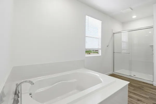 a white bath tub sitting in a bathroom