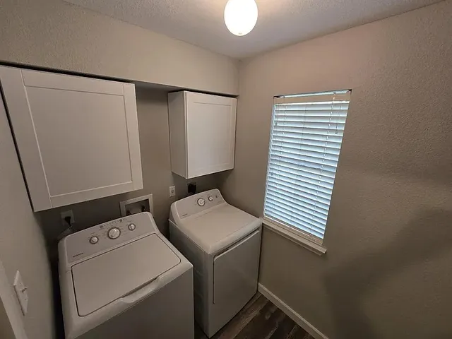 a utility room with dryer and washer