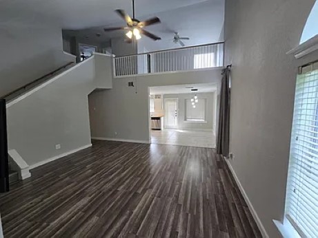 811 Chiselpoint Cove Round Rock, TX 78681 - Photo 3 of 13 wooden floor in an empty room with a window