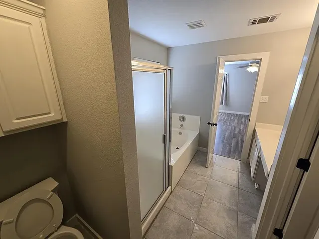 a bathroom with a sink a toilet a mirror and vanity