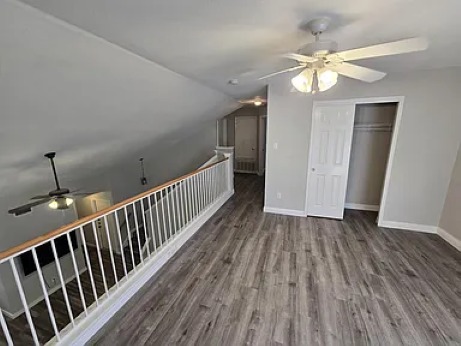 811 Chiselpoint Cove Round Rock, TX 78681 - Photo 8 of 13 a view of a hallway with wooden floor and chandelier