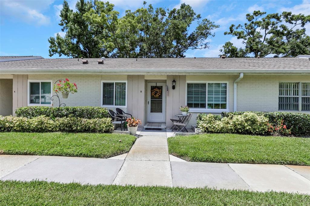 1011 Dunrobin Drive, Unit B Palm Harbor, FL 34684 - Photo 6 of 37 a view of a house with a yard