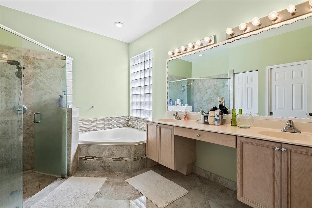 9728 Vineyard Court Boca Raton, FL 33428 - Photo 11 of 17 a bathroom with a tub sink shower and mirror