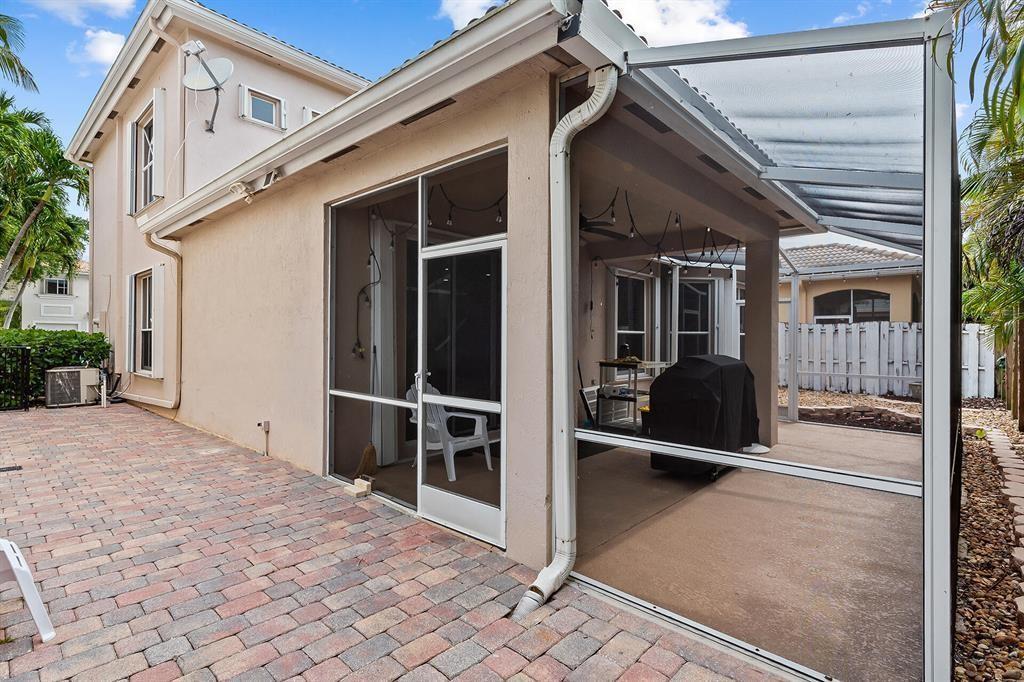 9728 Vineyard Court Boca Raton, FL 33428 - Photo 16 of 17 a view of a house with backyard and porch