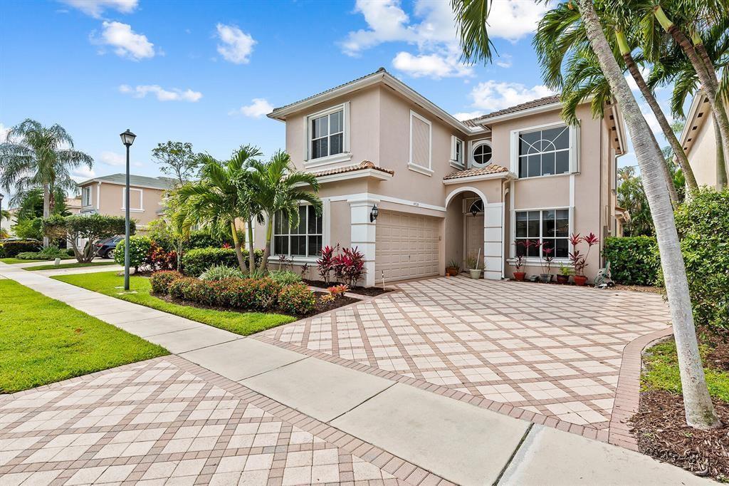 9728 Vineyard Court Boca Raton, FL 33428 - Photo 2 of 17 a front view of a house with yard