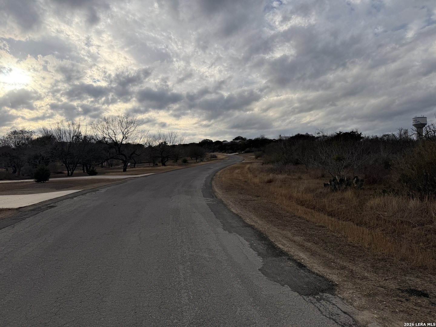 377 County Road 367 Hondo, TX 78861 - Photo 2 of 8 a view of a city street with a car parked on the road