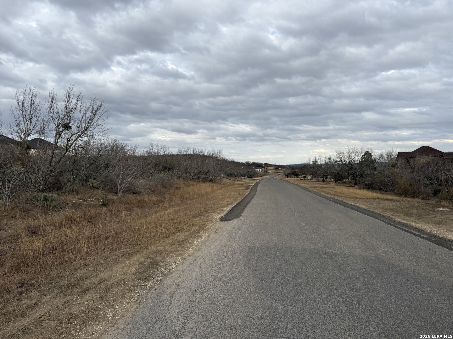 377 County Road 367 Hondo, TX 78861 - Photo 3 of 8 a view of a road with wooden fence