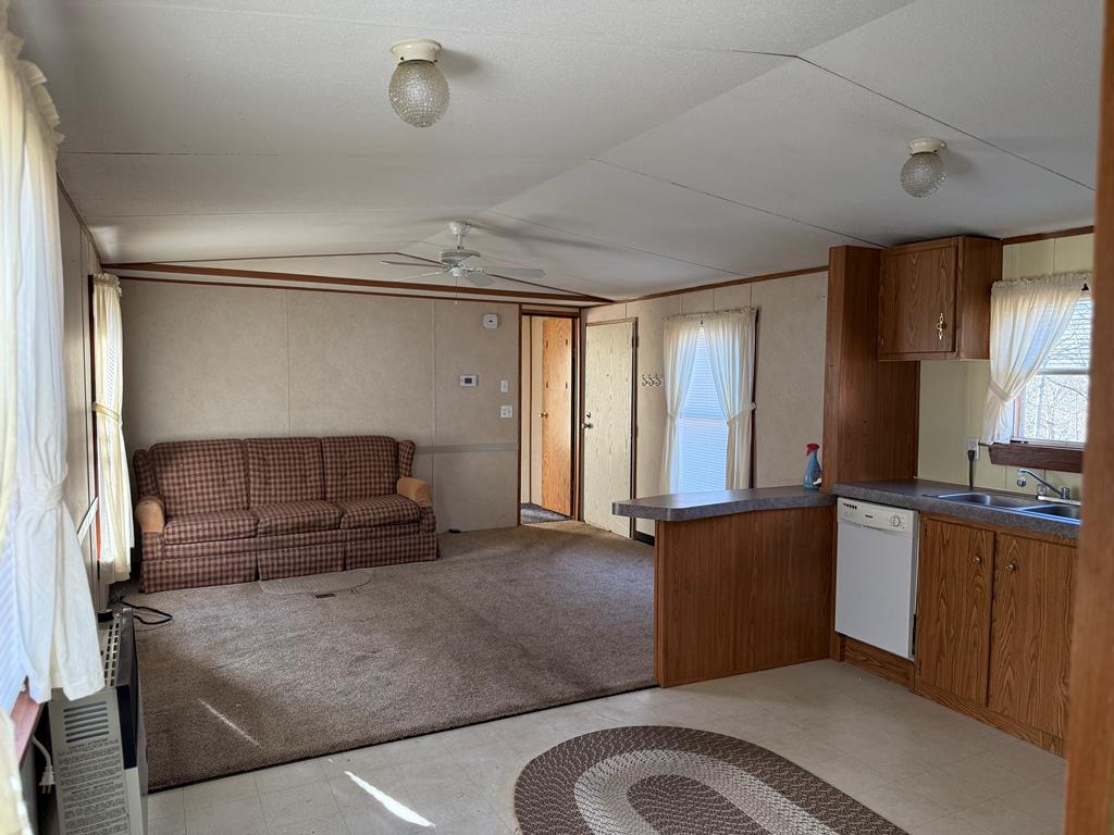 354 Ridgeview Circle Morganton, GA 30560 - Photo 3 of 10 a living room with stainless steel appliances kitchen island granite countertop a refrigerator and a stove top oven
