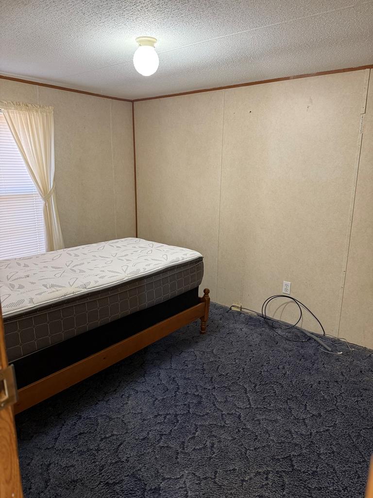 354 Ridgeview Circle Morganton, GA 30560 - Photo 6 of 10 a bedroom with a bed and wooden floor