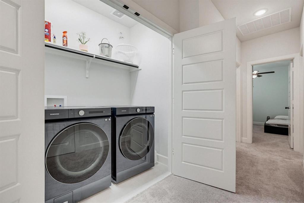 9341 Loggerhead Way Fort Worth, TX 76118 - Photo 25 of 35 Dedicated laundry closet featuring a built-in shelf, white walls, and light-colored flooring