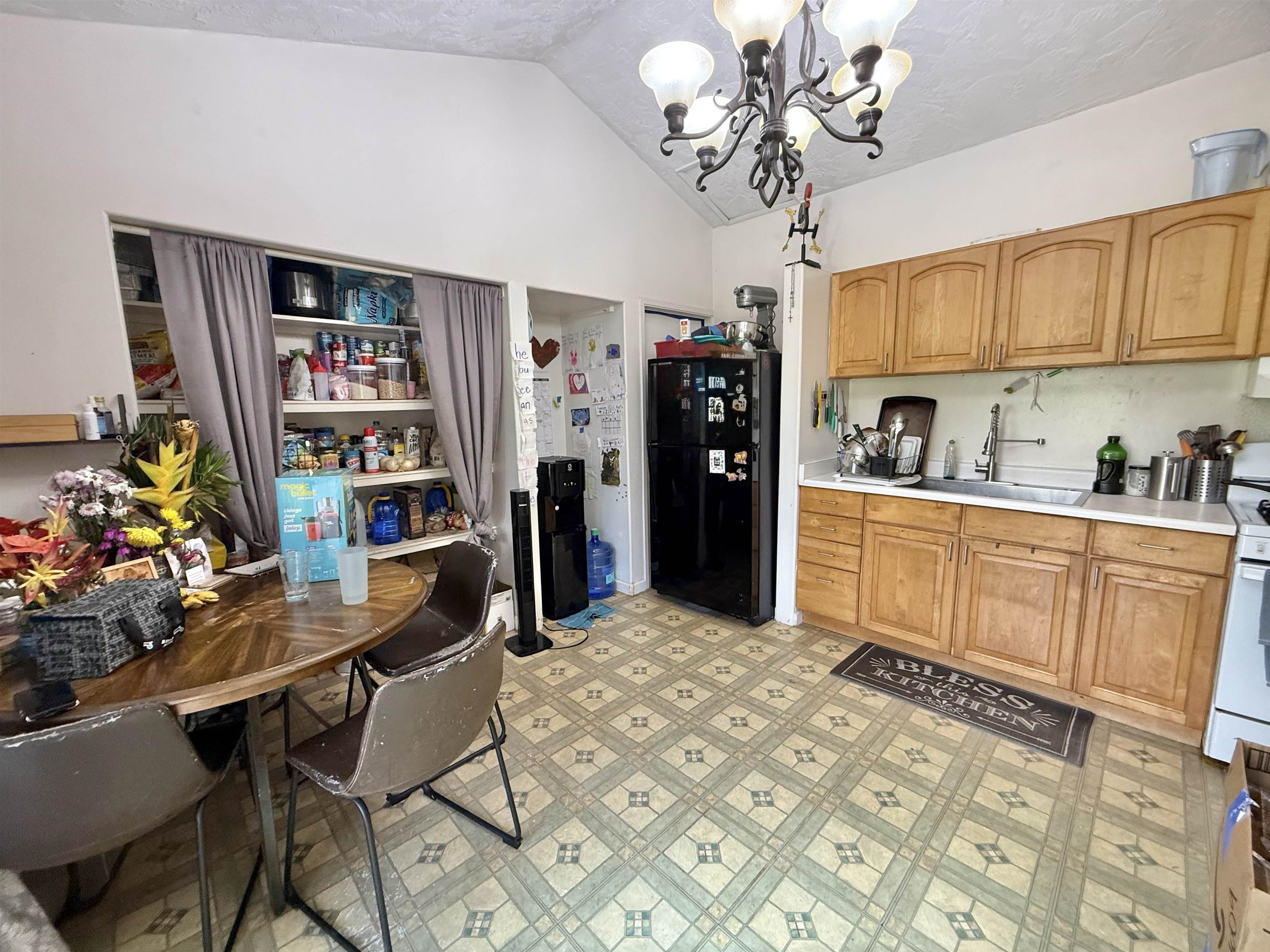 1630 Kauhikoa Road Haiku, HI 96708 - Photo 34 of 48 a kitchen with stainless steel appliances granite countertop a sink and cabinets