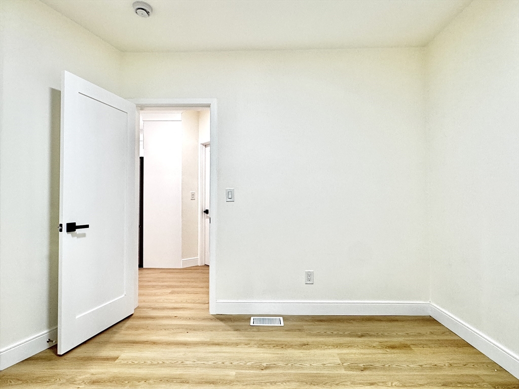 78 Orchard Street, Unit 78 Medford, MA 02155 - Photo 6 of 11 a view of a room with wooden floor