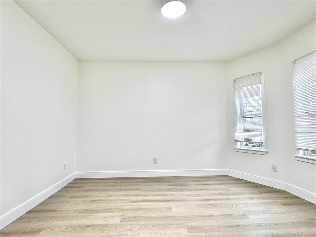 78 Orchard Street, Unit 78 Medford, MA 02155 - Photo 10 of 11 a view of a room with window and wooden floor