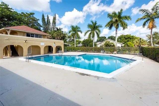 a view of a house with swimming pool