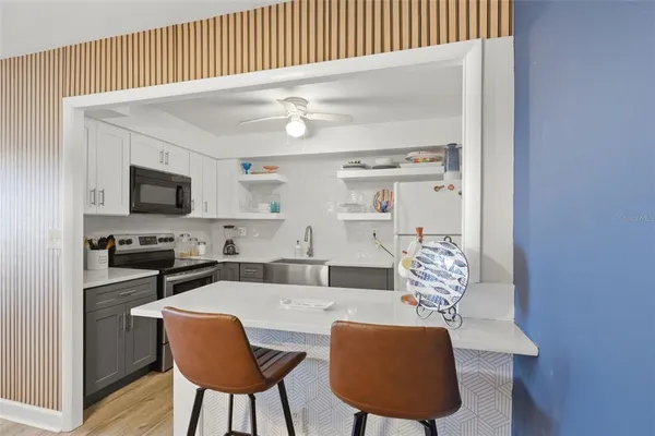 a bathroom with a sink toilet tub and shower