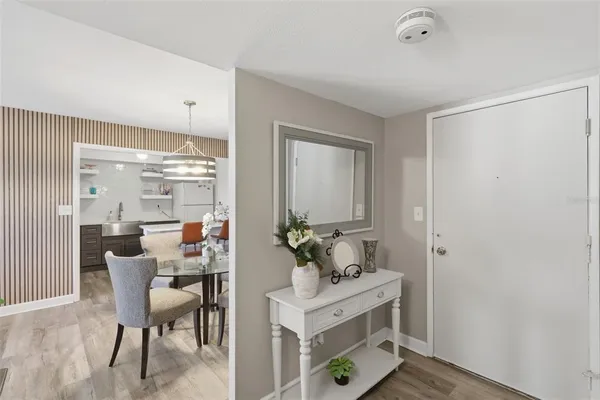 a kitchen with stainless steel appliances a stove microwave and sink