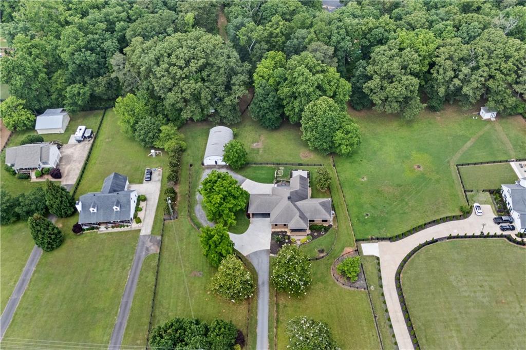 16175 Hopewell Road Milton, GA 30004 - Photo 1 of 1 an aerial view of a house with a yard basket ball court and outdoor seating