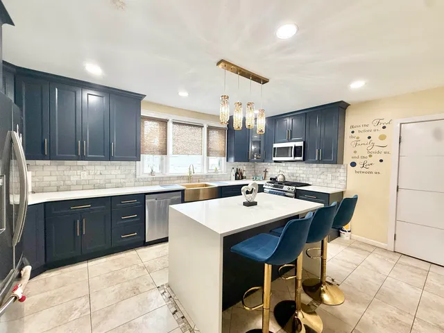 a kitchen with a sink cabinets and window