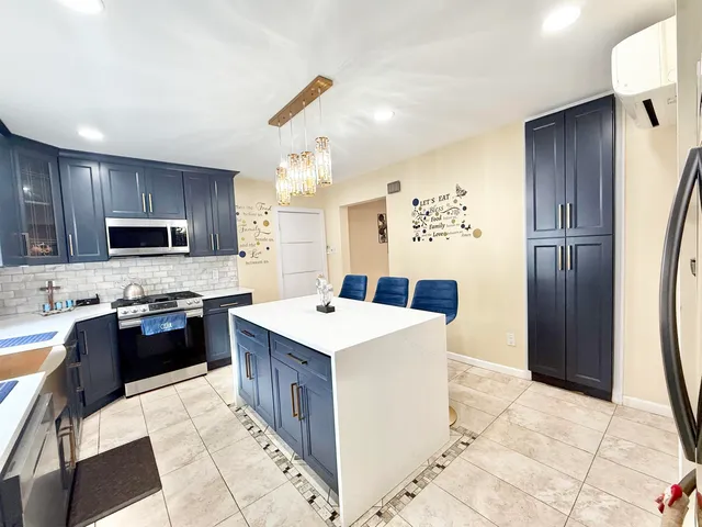 a view of a hallway with furniture and entryway