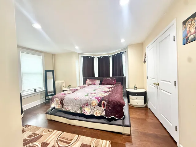 a bathroom with a toilet a sink and a window