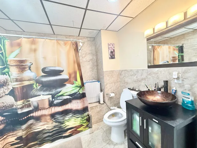 a living room with a couch and a large window