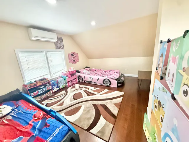 a bedroom with furniture and a window