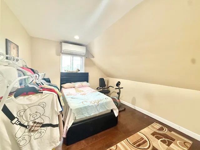 a bathroom with a sink mirror vanity and toilet