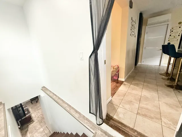 a living room with furniture lamp and rug