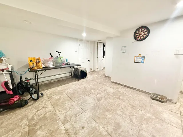 a utility room with furniture and toys