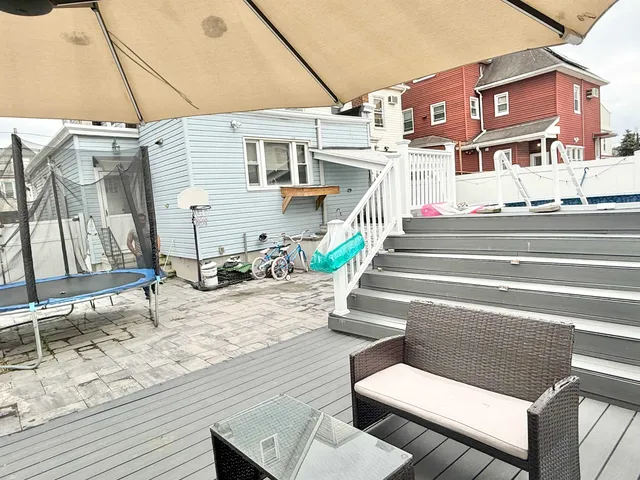 a view of terrace with seating area and utility