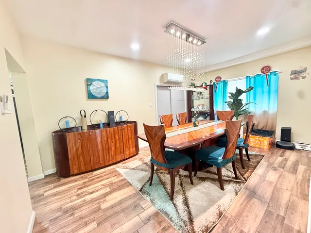 a kitchen with a sink a counter top space appliances and cabinets