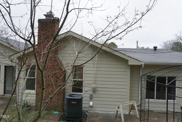 a view of a house with a tree
