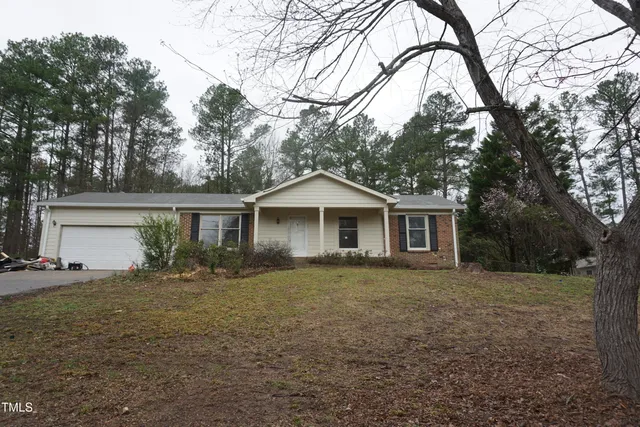 a front view of a house with yard