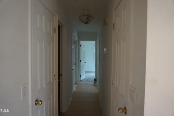 a view of a bathroom from a hallway