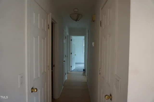 a view of a bathroom from a hallway