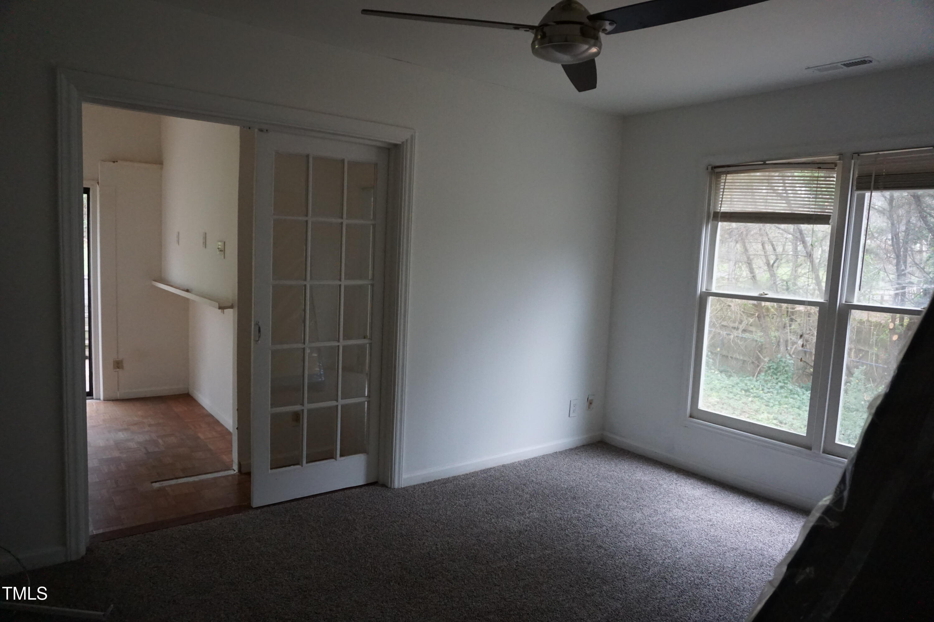5504 Pelham Road Durham, NC 27713 - Photo 9 of 23 an empty room with windows