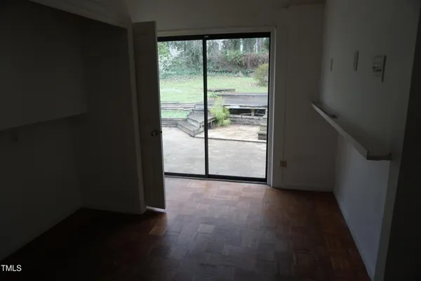 a view of an empty room and a window