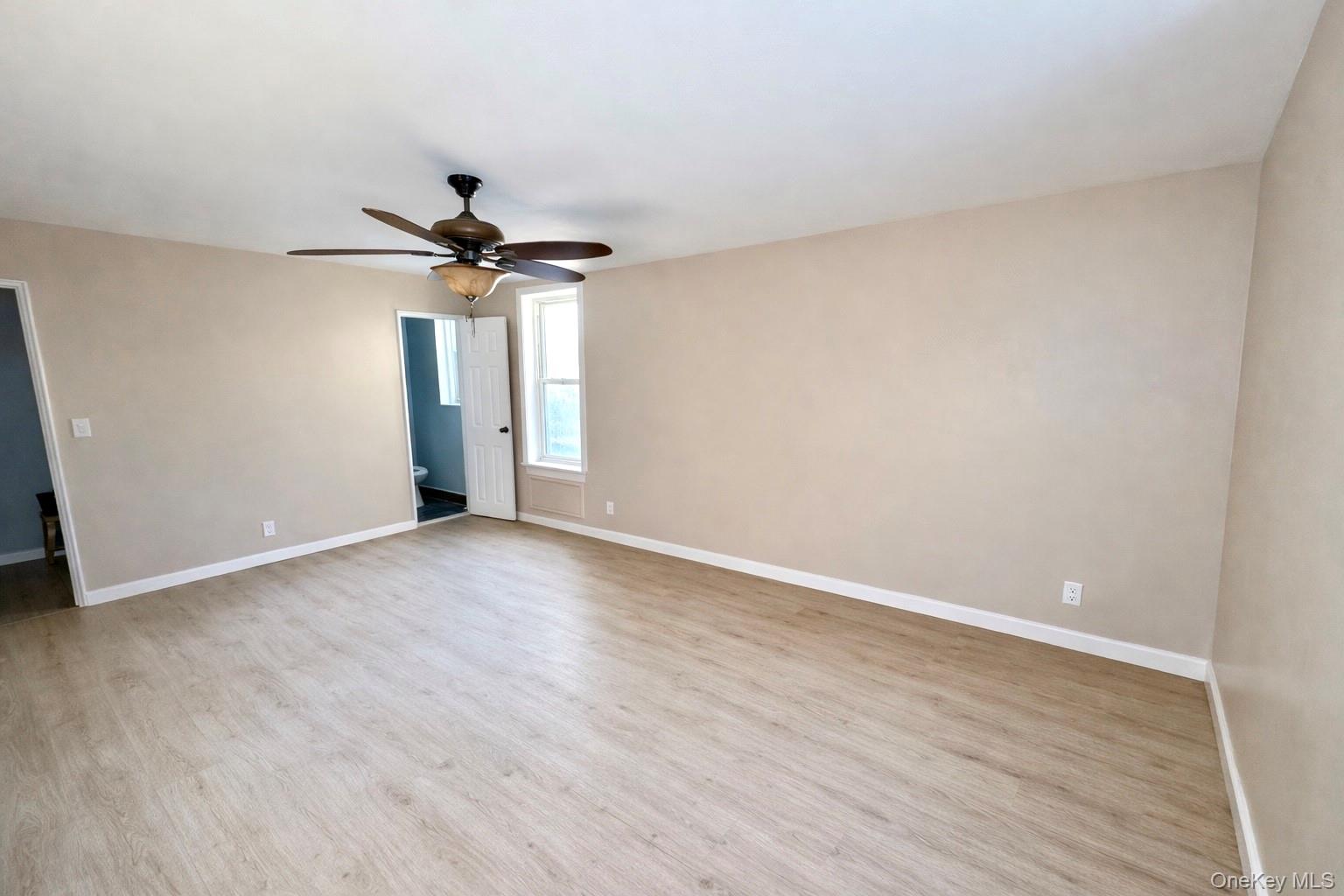 245 Rumsey Road, Unit 3E Yonkers, NY 10701 - Photo 14 of 24 a view of an empty room with a ceiling fan