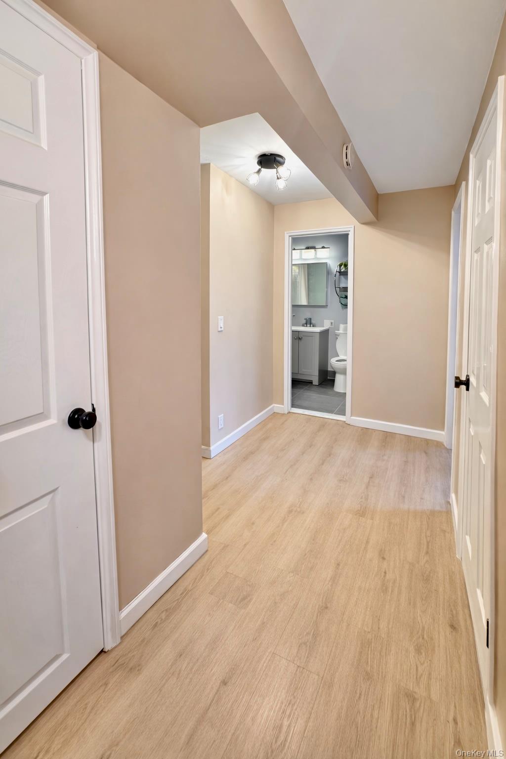 245 Rumsey Road, Unit 3E Yonkers, NY 10701 - Photo 16 of 24 wooden floor in an empty room with a window