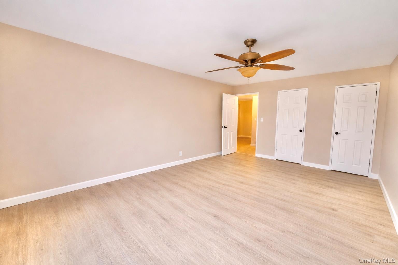 245 Rumsey Road, Unit 3E Yonkers, NY 10701 - Photo 18 of 24 an empty room with a window and a fan