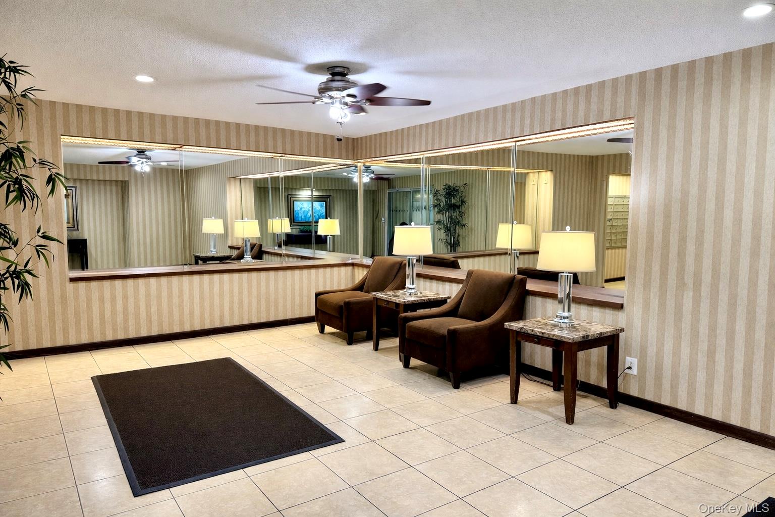 245 Rumsey Road, Unit 3E Yonkers, NY 10701 - Photo 19 of 24 a living room with furniture and a chandelier