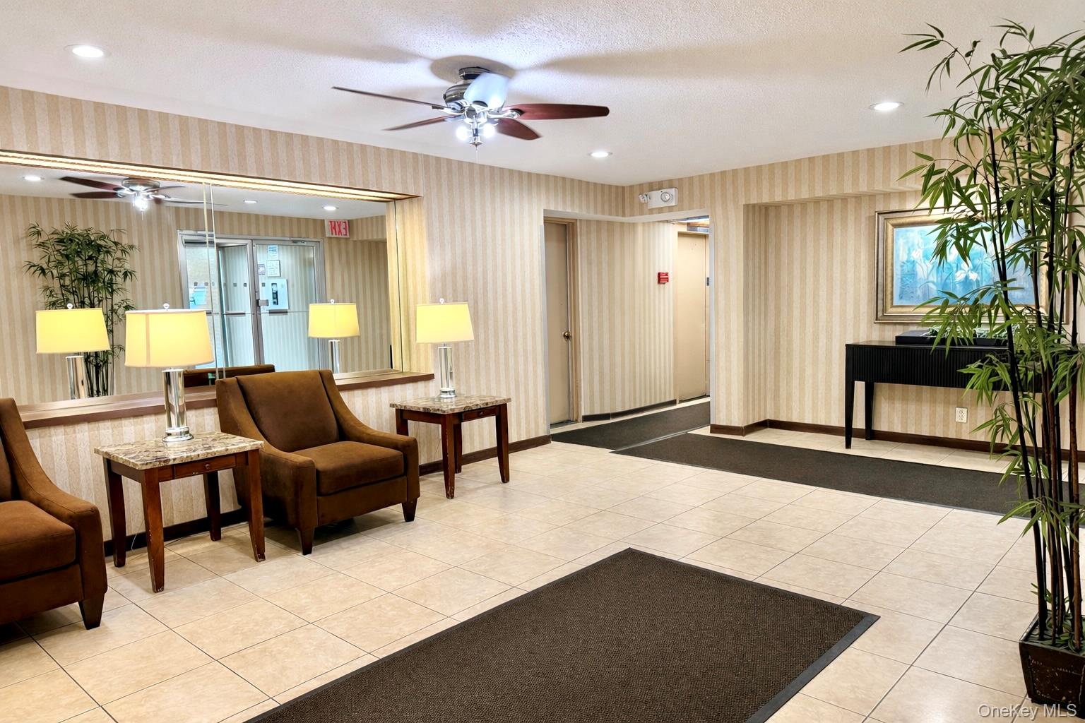 245 Rumsey Road, Unit 3E Yonkers, NY 10701 - Photo 20 of 24 a living room with furniture and a chandelier