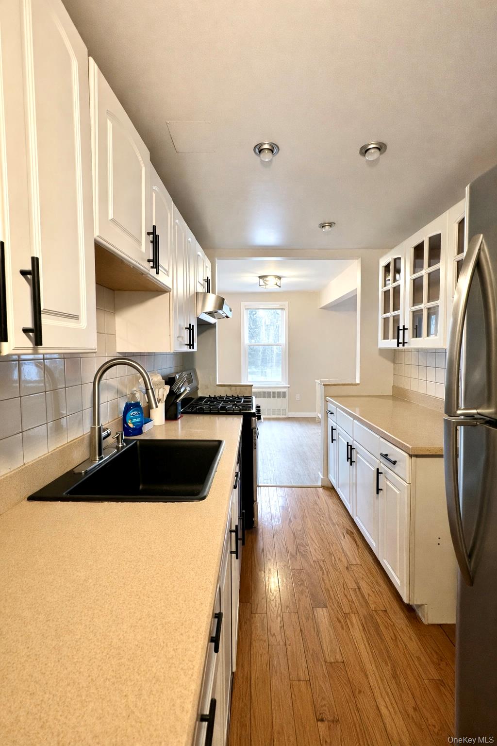 245 Rumsey Road, Unit 3E Yonkers, NY 10701 - Photo 10 of 24 a kitchen with stainless steel appliances granite countertop a sink a stove and a refrigerator