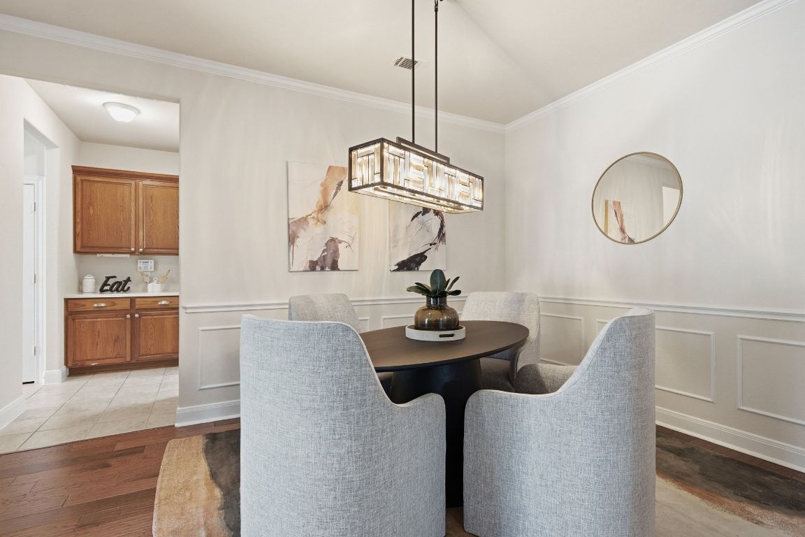 512 Armstrong Drive Georgetown, TX 78633 - Photo 13 of 40 a dining room with furniture and wooden floor
