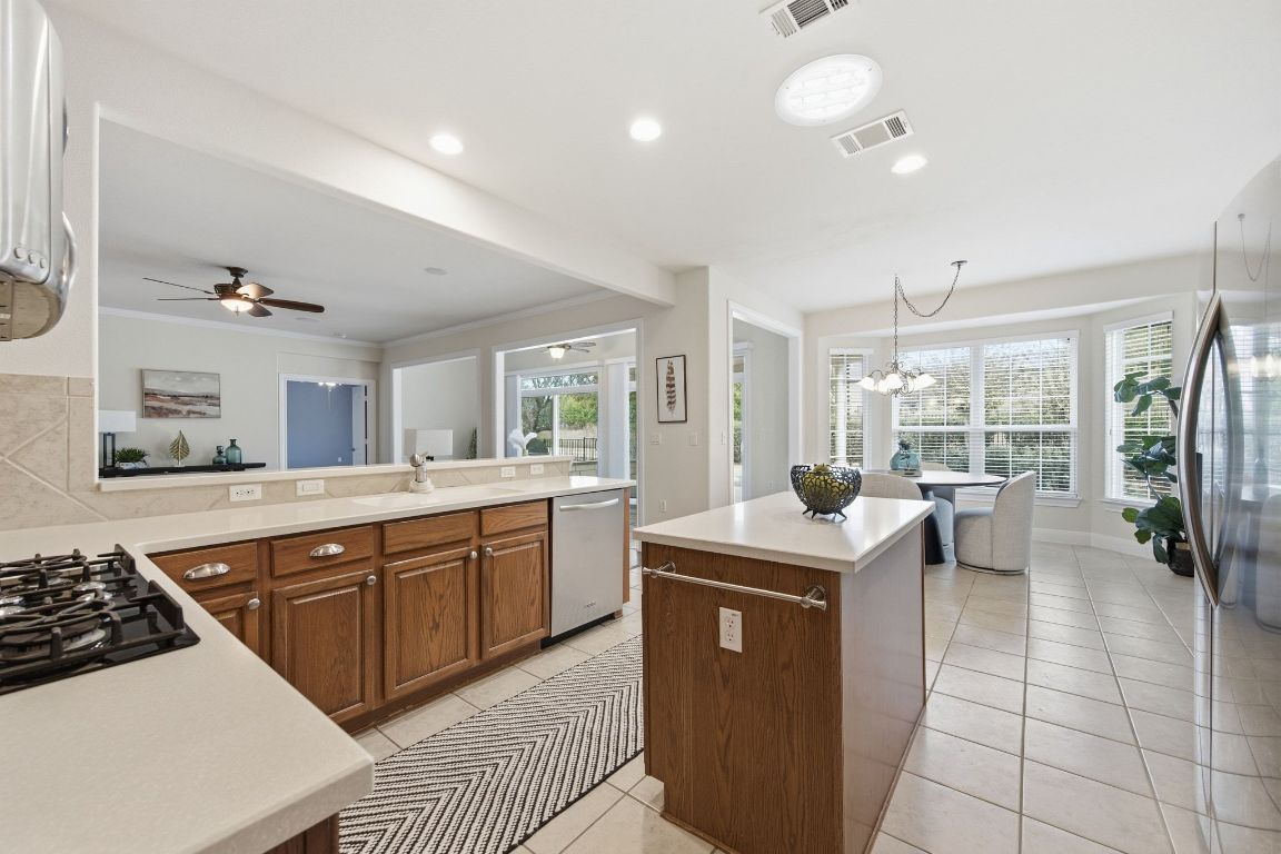 512 Armstrong Drive Georgetown, TX 78633 - Photo 18 of 40 a kitchen with a sink a counter top space and stainless steel appliances