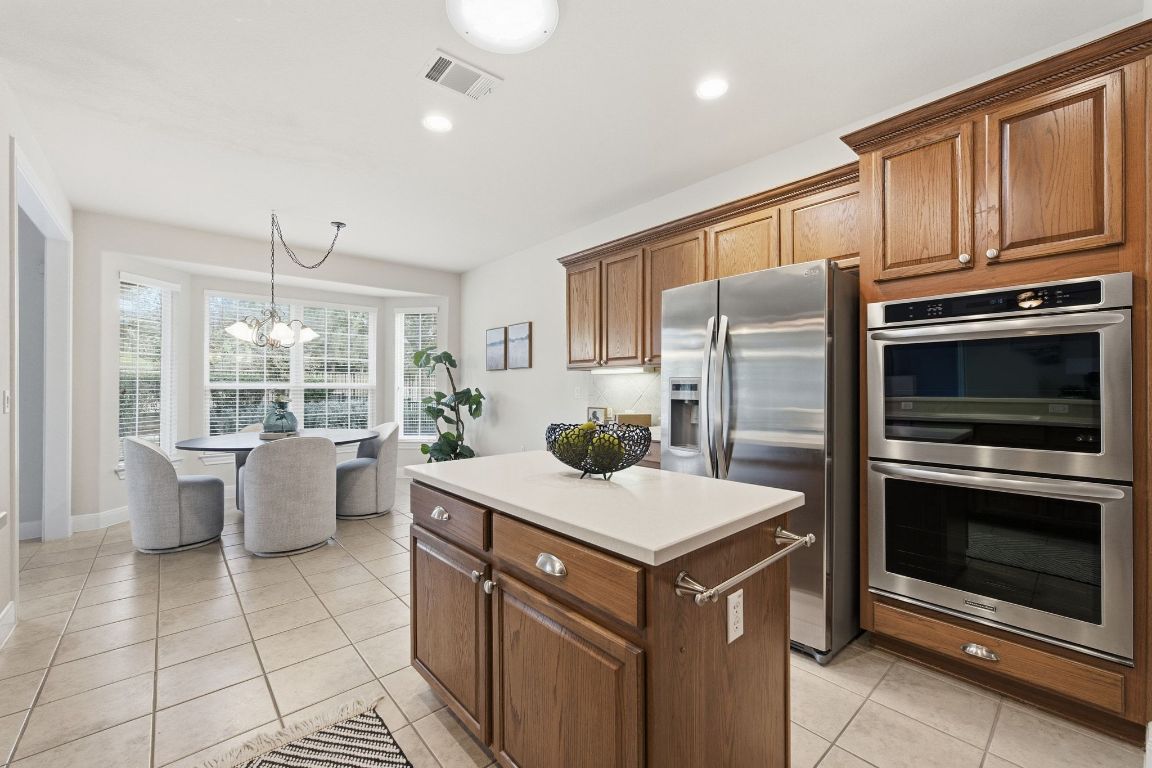 512 Armstrong Drive Georgetown, TX 78633 - Photo 20 of 40 a kitchen with a stove a sink and a refrigerator