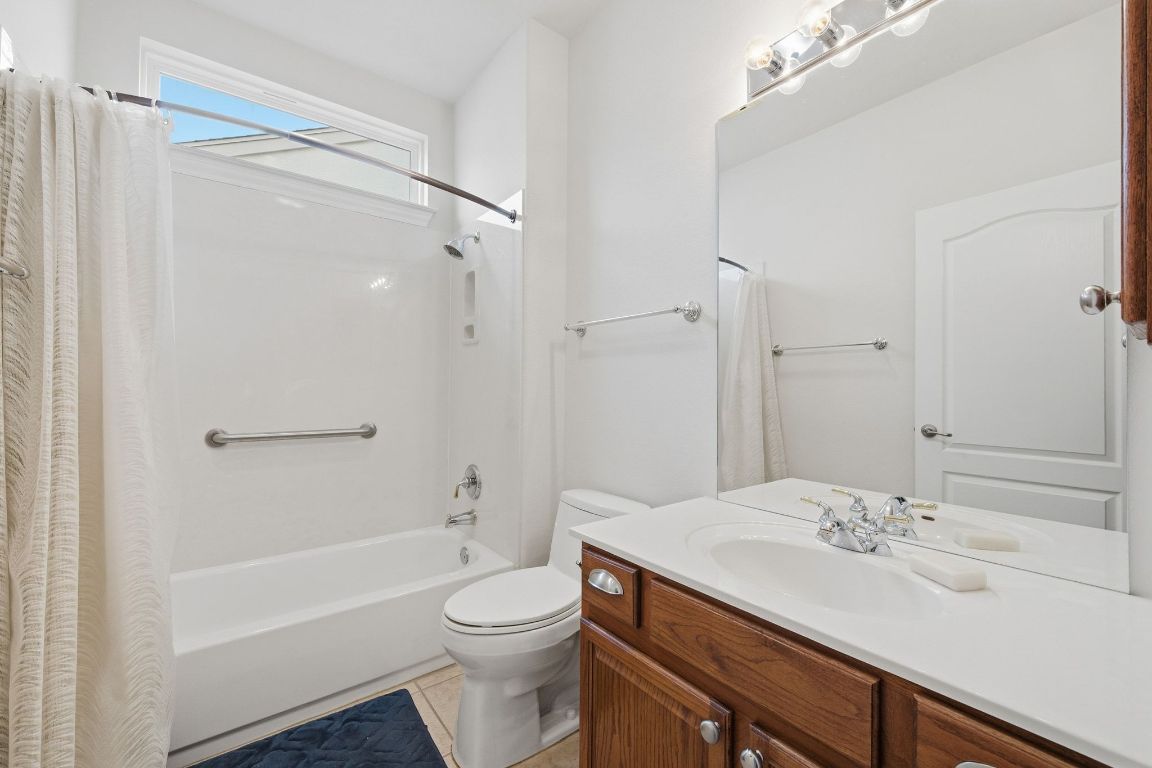 512 Armstrong Drive Georgetown, TX 78633 - Photo 31 of 40 a bathroom with a sink a toilet and shower