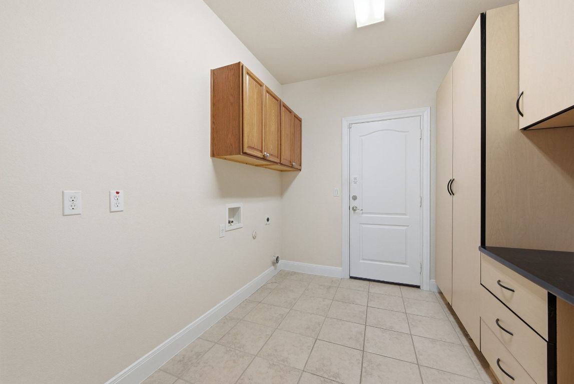512 Armstrong Drive Georgetown, TX 78633 - Photo 32 of 40 a view of a kitchen with cabinets